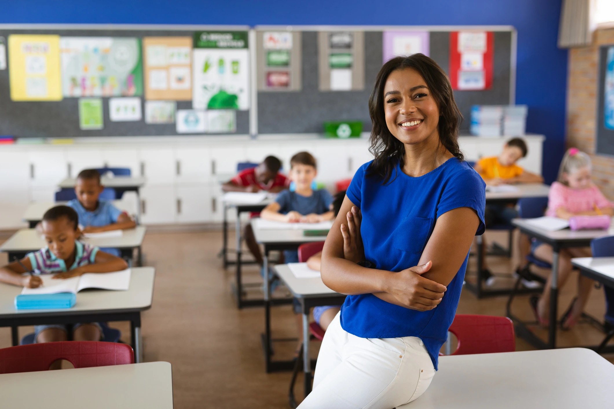 Teacher in a classroom with young students